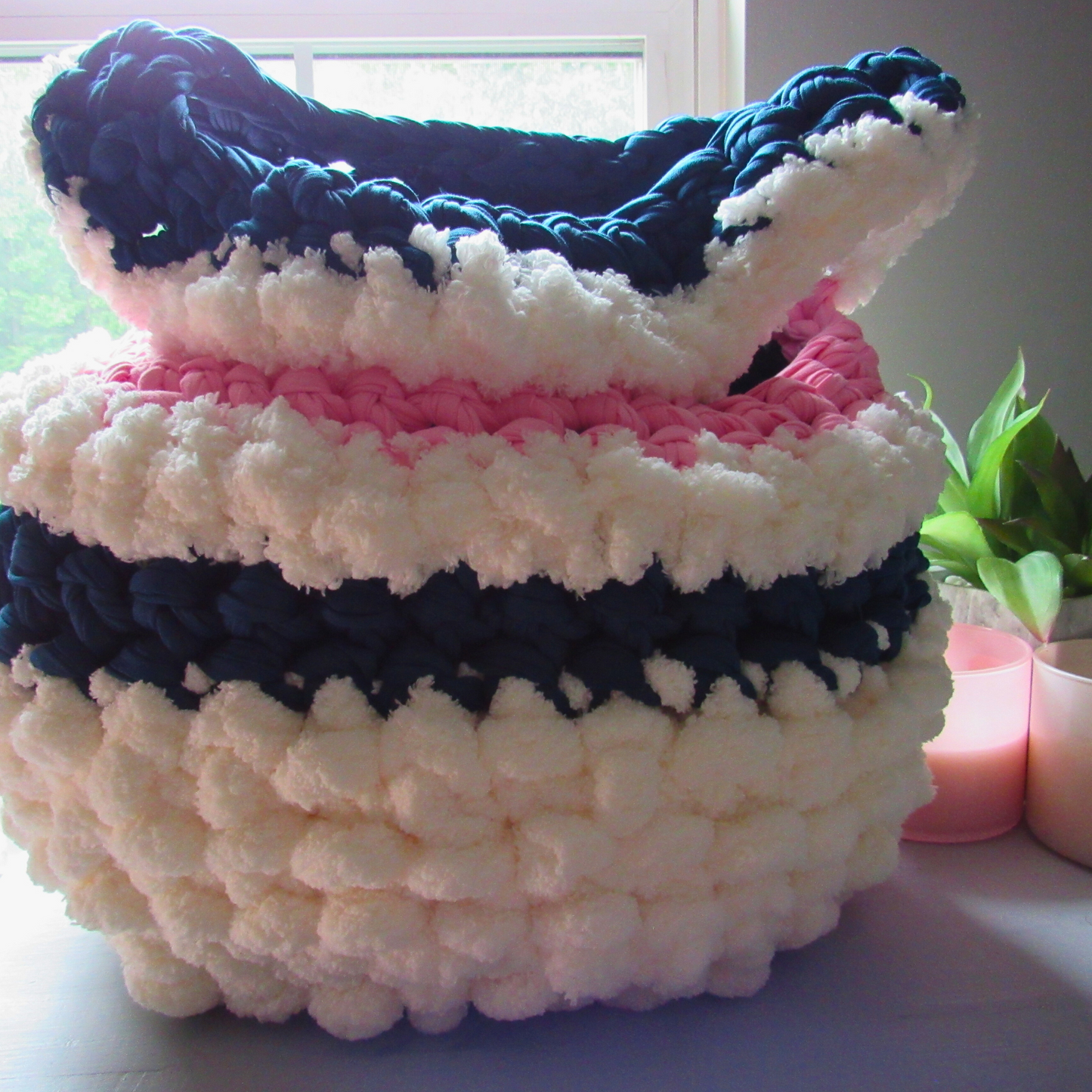 white crocheted storage basket in front of window