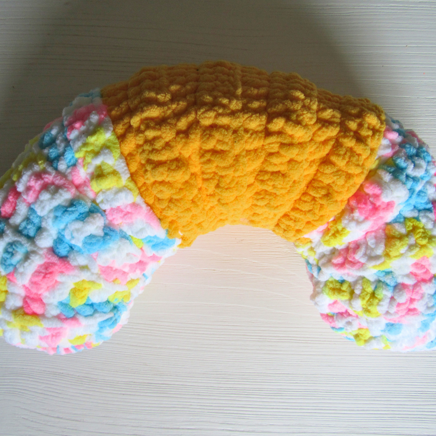 Cozy Curve Handmade Neck Pillow in bright yellow and multicolored pattern